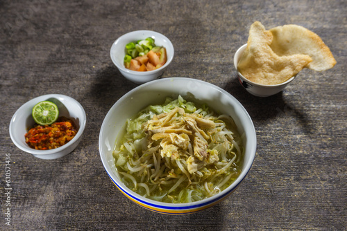 Soto ayam is a typical Indonesian food in the form of a kind of chicken soup with a yellowish sauce.  