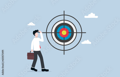 Concentration and focus on business target,  directing attention toward achieving goal or objective concept, Businessman looking directly at target inside aim symbol.