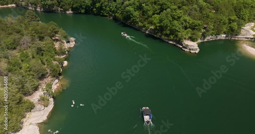 Bird's eye view of peaceful lake in Hogscald Hollow, USA, boats navigating photo