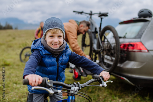 Fototapeta Naklejka Na Ścianę i Meble -  Young boy looking forward to bicycle ride in nature.