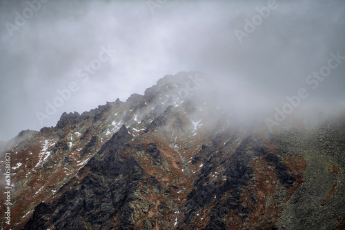 Landscape of mountain peak in low clouds. © Halfpoint