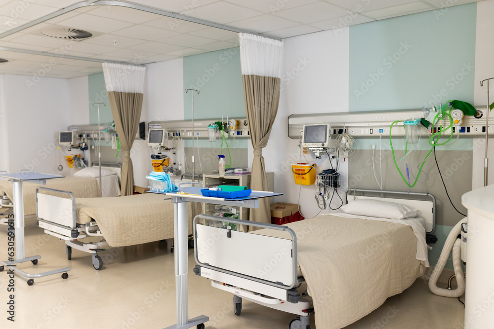 General view of room with beds and medical equipment at hospital