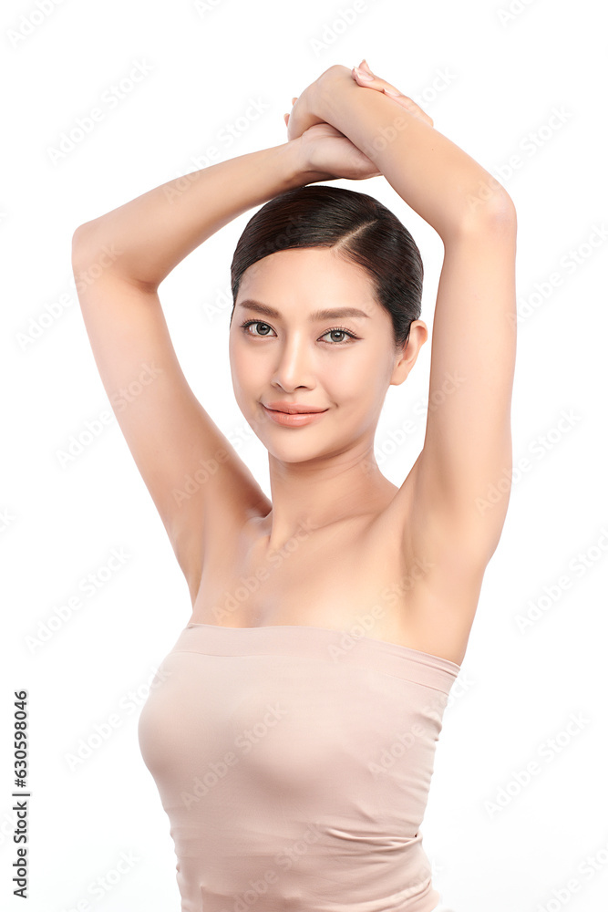 Beautiful Young Asian woman lifting hands up to show off clean and hygienic armpits or underarms on white background, Smooth armpit cleanliness and protection concept Beautiful Young Asian woman lifting hands up to show off clean and hygienic armpits or underarms on white background, Smooth armpit cleanliness and protection concept