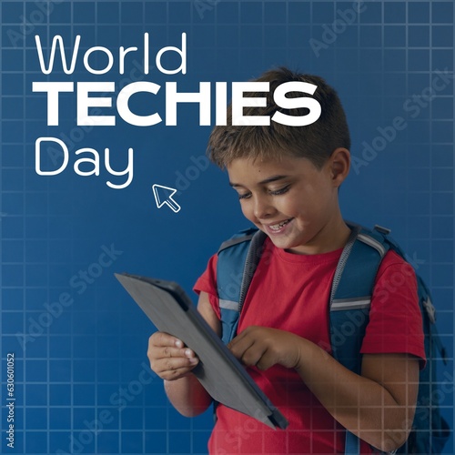 World techies day text over happy caucasian schoolboy using tablet, on blue