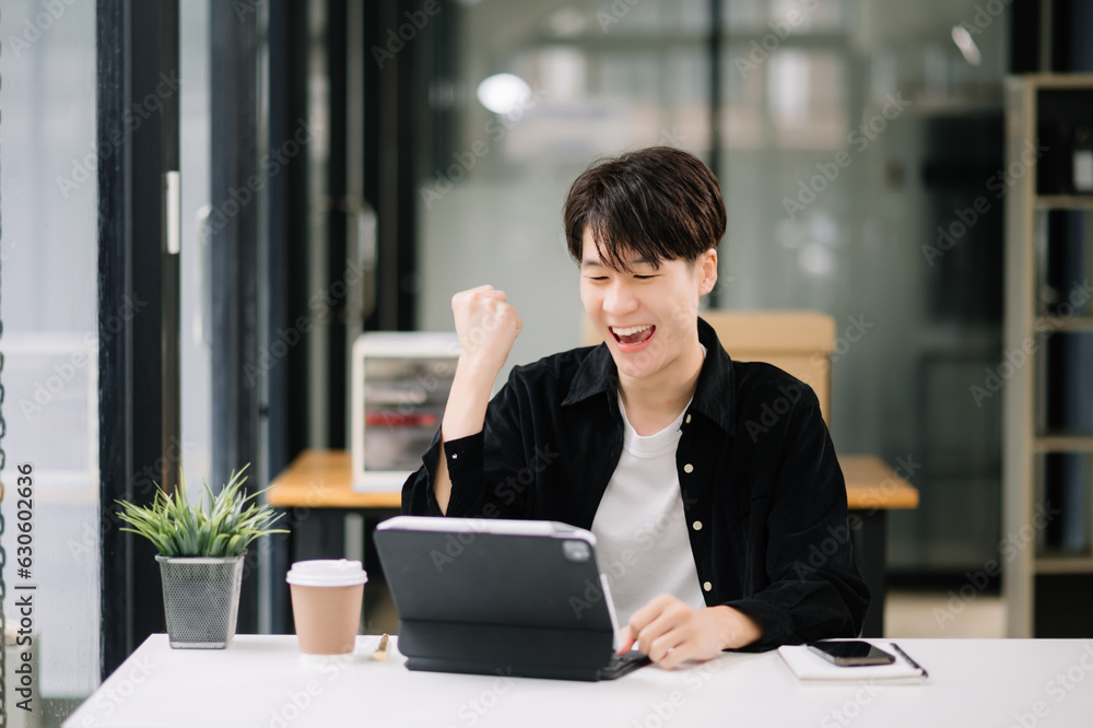 Asian businessman are delighted and happy with the work they do on their tablet, laptop and taking notes at office. Asian businessman are delighted and happy with the work they do on their tablet, laptop and taking notes at office.