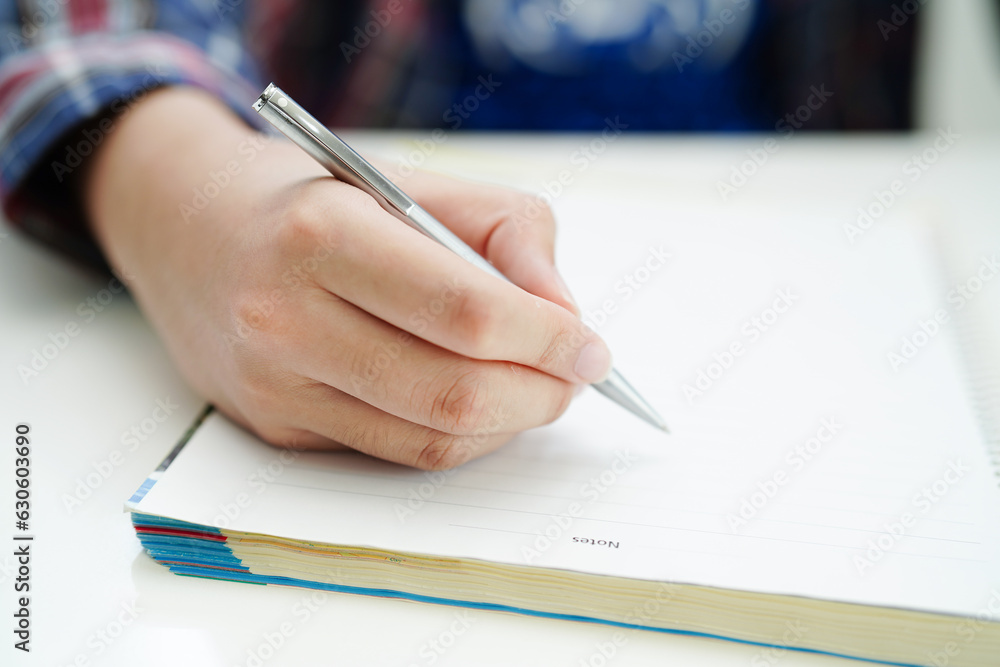 Asian teenage student write homework, study lesson for exam online learning education. Asian teenage student write homework, study lesson for exam online learning education.
