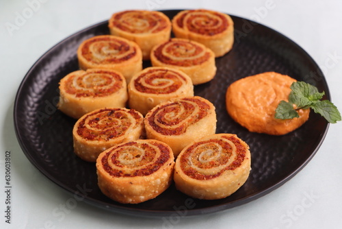 Pinwheel Samosa, are small bite sized snacks in the shape of a pinwheel and filled with a spicy potato stuffing, baked or fried, starter or appetizer