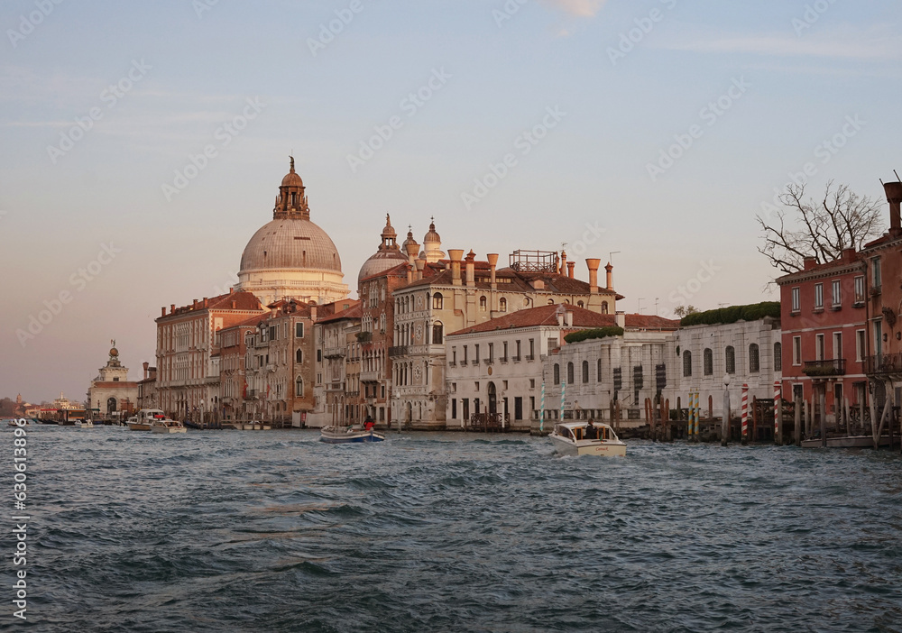 Historical buildings of Venice in the rays of the setting sun