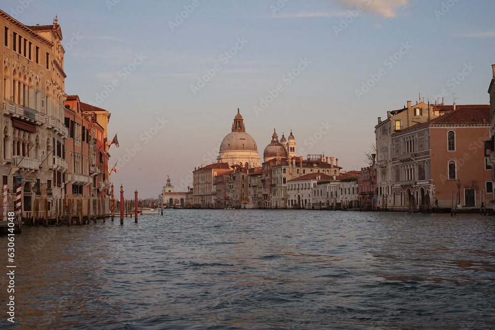 Historical buildings of Venice in the rays of the setting sun