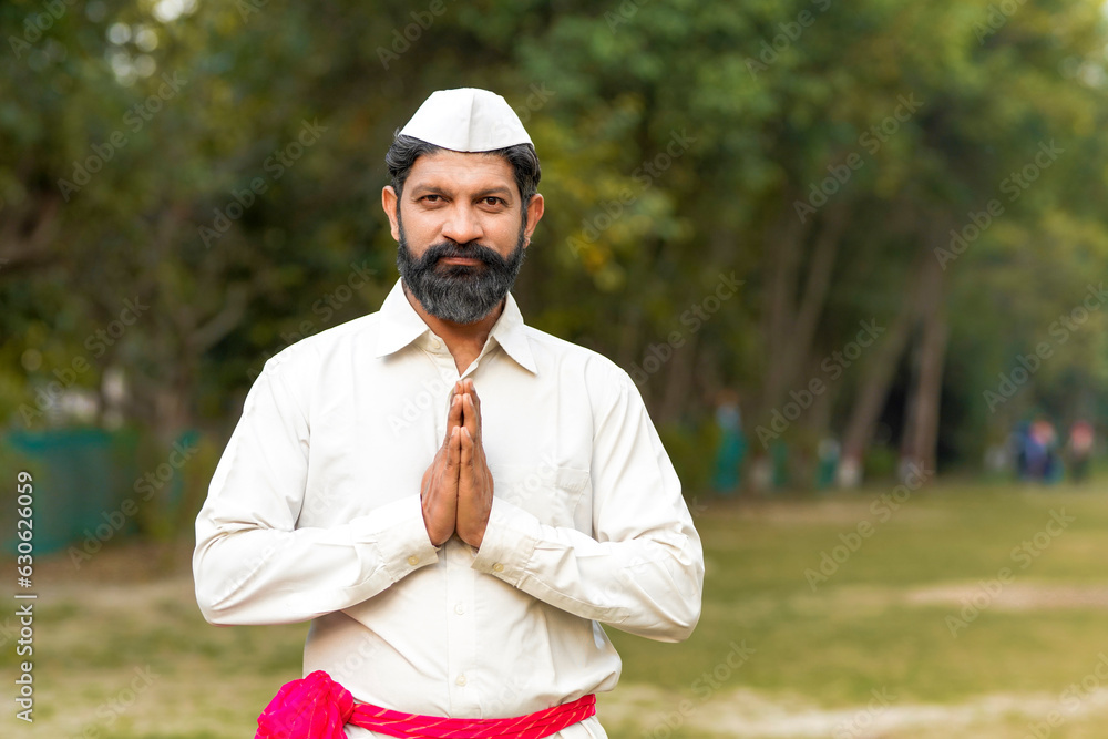 Young indian man in traditional wear giving Namaste or welcome gesture. Young indian man in traditional wear giving Namaste or welcome gesture.