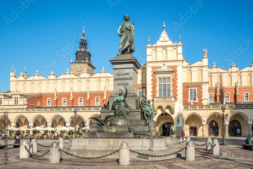 View at the Adam Mickiewicz Monument with Town hall building at Principal place in Krakow - Poland