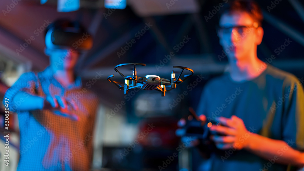 Teens remotely controlling robots in a laboratory