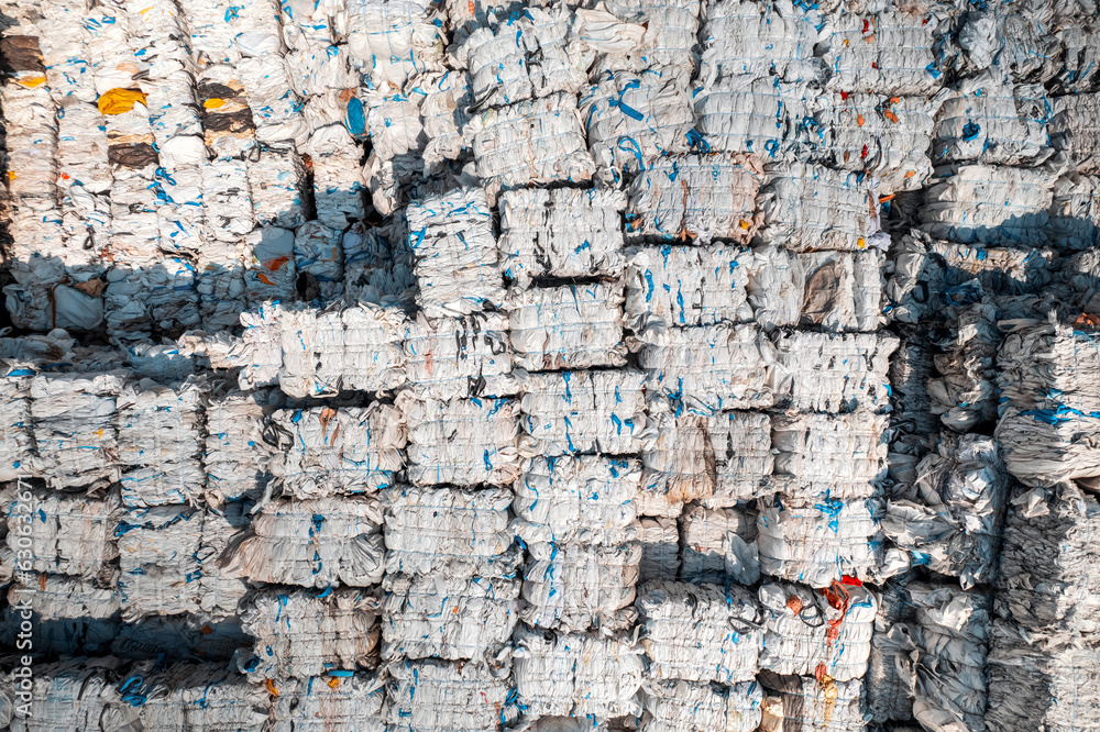 Cubes of compressed plastic garbage at a waste recycling factory