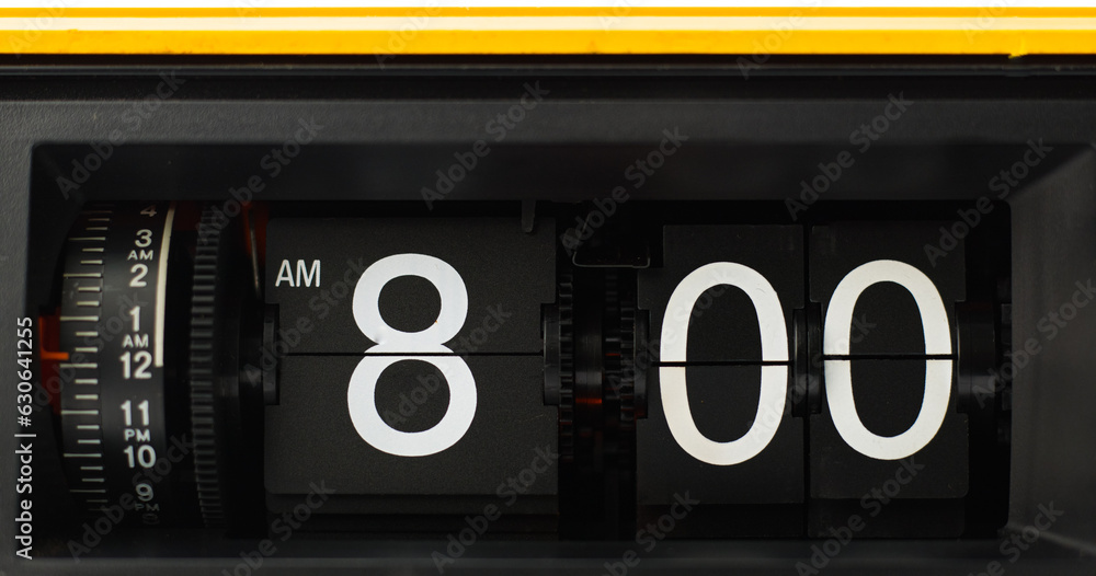 Flip clock White numbers on a black background star time 8.00 am. Flip clock White numbers on a black background star time 8.00 am.
