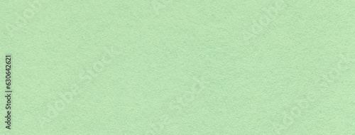 Texture of craft light green and mint paper background colors, macro. Structure of vintage kraft olive cardboard.