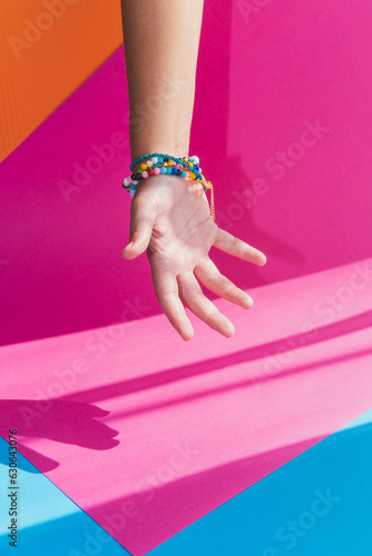 Open hand with jewelry bracelet accessories in beauty and fashion barbie style