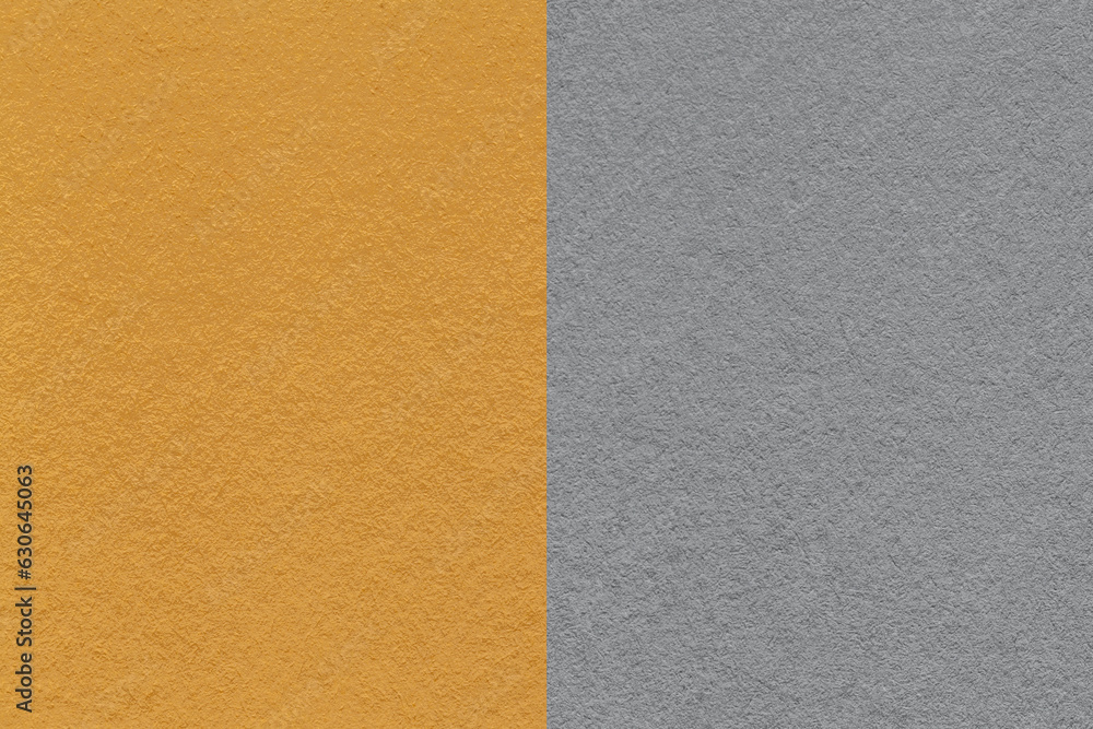 Fototapeta premium Texture of craft dark yellow and gray paper background, half two colors, macro. Vintage ocher cardboard.