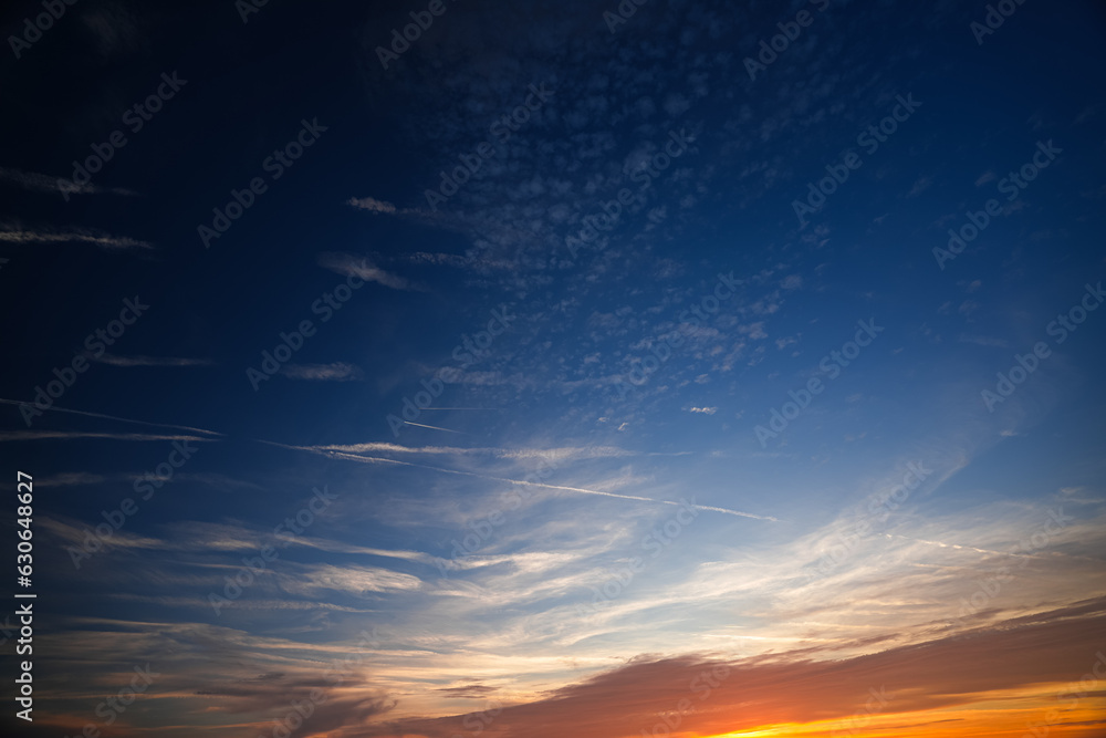 Beautiful clouds sky during summer sunrise. Amazing nature sunrise landscape photo.