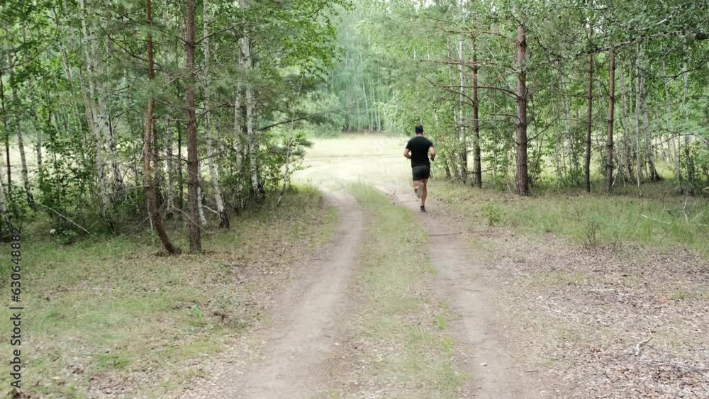 Outdoor sports.An athlete in sports gear runs in the woods on the road.Slow motion.Healthy lifestyle
Outdoor sports.An athlete in sports gear runs in the woods on the road.Slow motion.Healthy lifestyle
