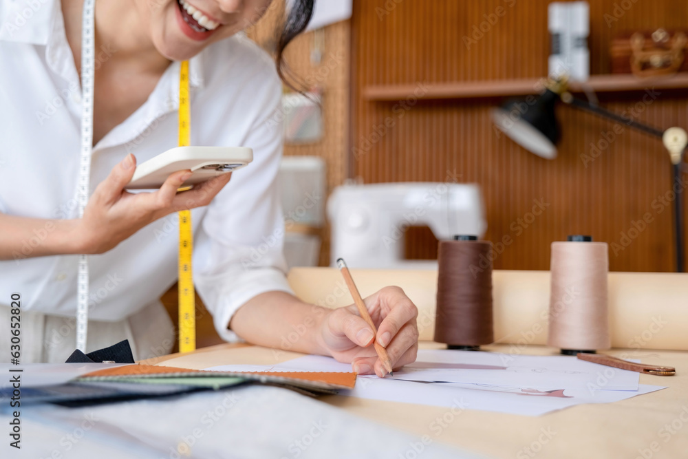 Young female designer engages with customers. Young female designer engages with customers.