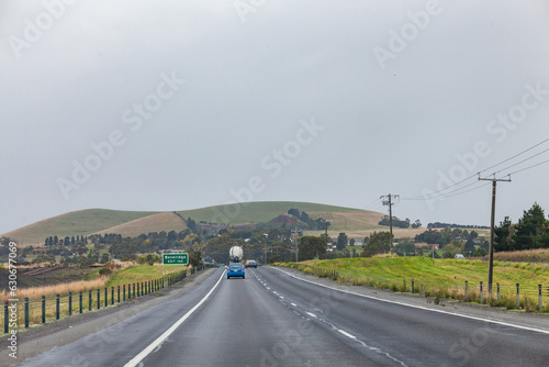 cars driving down freeway on overcast day in Bevridge vic on Hume freeway photo