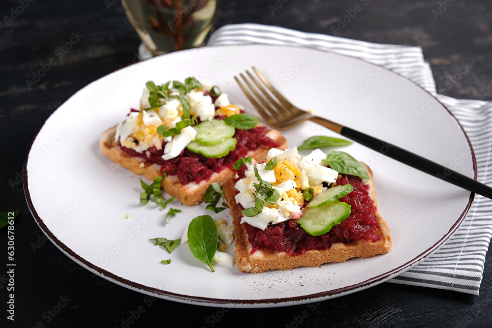 Healthy toast with pate beetroot, boiled eggs, basil and cucumbers. Delicious breakfast or snack. Healthy toast with pate beetroot, boiled eggs, basil and cucumbers. Delicious breakfast or snack.