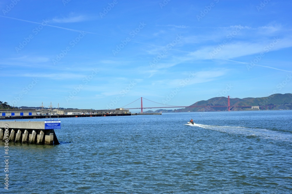 Pier39 San Francisco, California, USA - April 21, 2023. San Fransisco bay area with Golden gate bridge and Blue sky background.