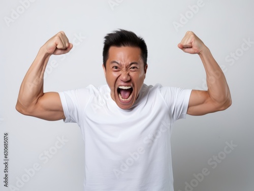 Photo shot of 30 years old asian man in emotional dynamic pose