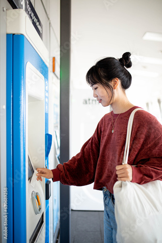 Asian young adult woman at a Sydney train station photo