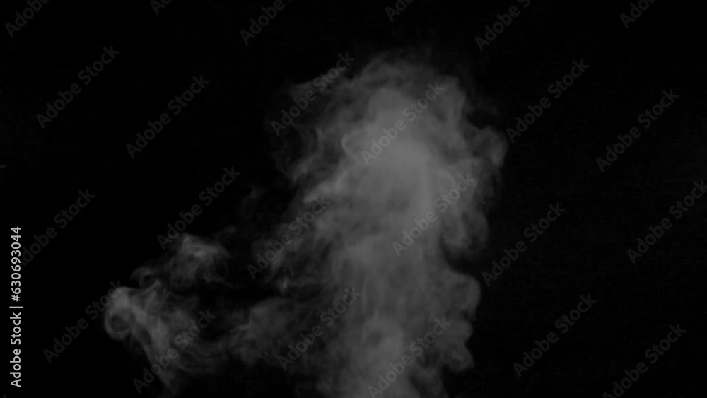 White smoke,steam on a black background. Slow motion. Shot in 4K resolution at 60fps. White smoke,steam on a black background. Slow motion. Shot in 4K resolution at 60fps.