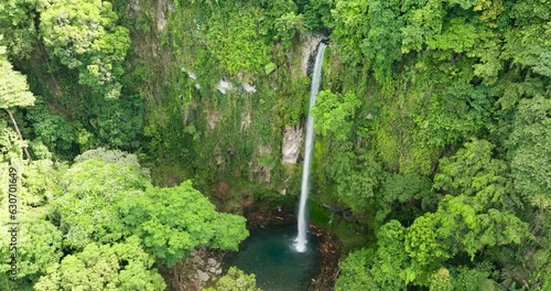 Katibawasan Falls with cold and freshwater surrounded by lush greenery. Camiguin Island. Philippines. View from above. photo