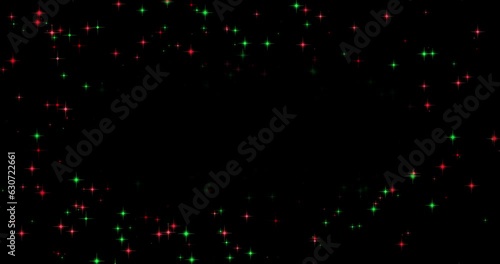 外側でキラキラ輝いている赤色と緑色の星のパーティクルエフェクト素材(黒背景)　クリスマスカラー