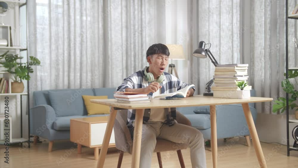 Tired Asian Teenager Yawning And Sleep On The Table At Home After Doing Home Work
Tired Asian Teenager Yawning And Sleep On The Table At Home After Doing Home Work