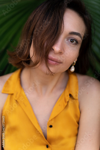 Young happy woman in yellow dress
