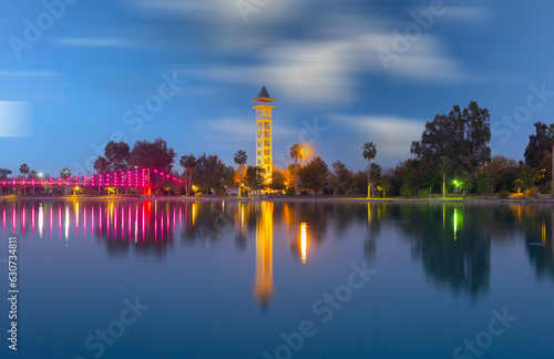 View of The Yuregir Clock Tower from Adana Central Park, in the Province of Adana. Seyhan River and Suspension Bridge