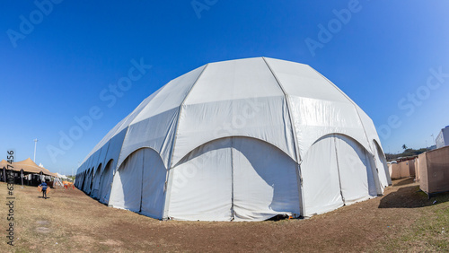Large Tent Portable Dome White Canvas Structure Entertainment Structure Close-up Blue Sky. 