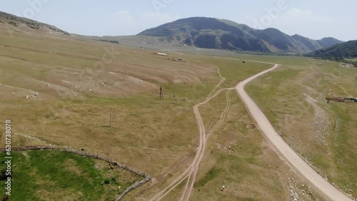 Semenovskoye Grigorevskoye Canyon mountains and green valley Kyrgystan near Issyk Kul. Aerial drone view. Flying over. High quality photo photo