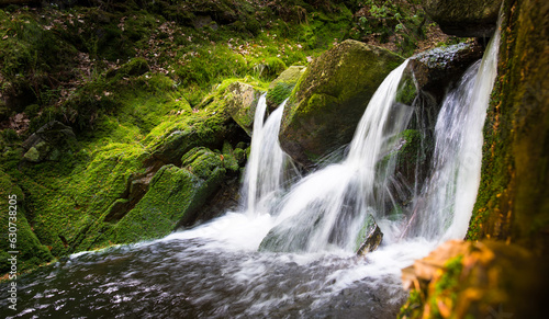 KRNAP (Krkonossky National Park), Czech Republic Krkonose mountains - waterfall scenic nature moss green background - white wild water falling from rocks making romantic veils. 