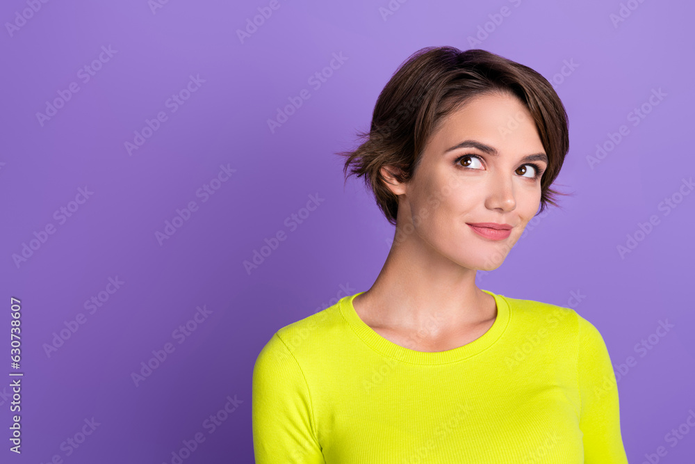 Portrait of young woman bob brown hair wearing trendy shirt looking dreamy empty space lovely thoughts isolated on violet color background Portrait of young woman bob brown hair wearing trendy shirt looking dreamy empty space lovely thoughts isolated on violet color background