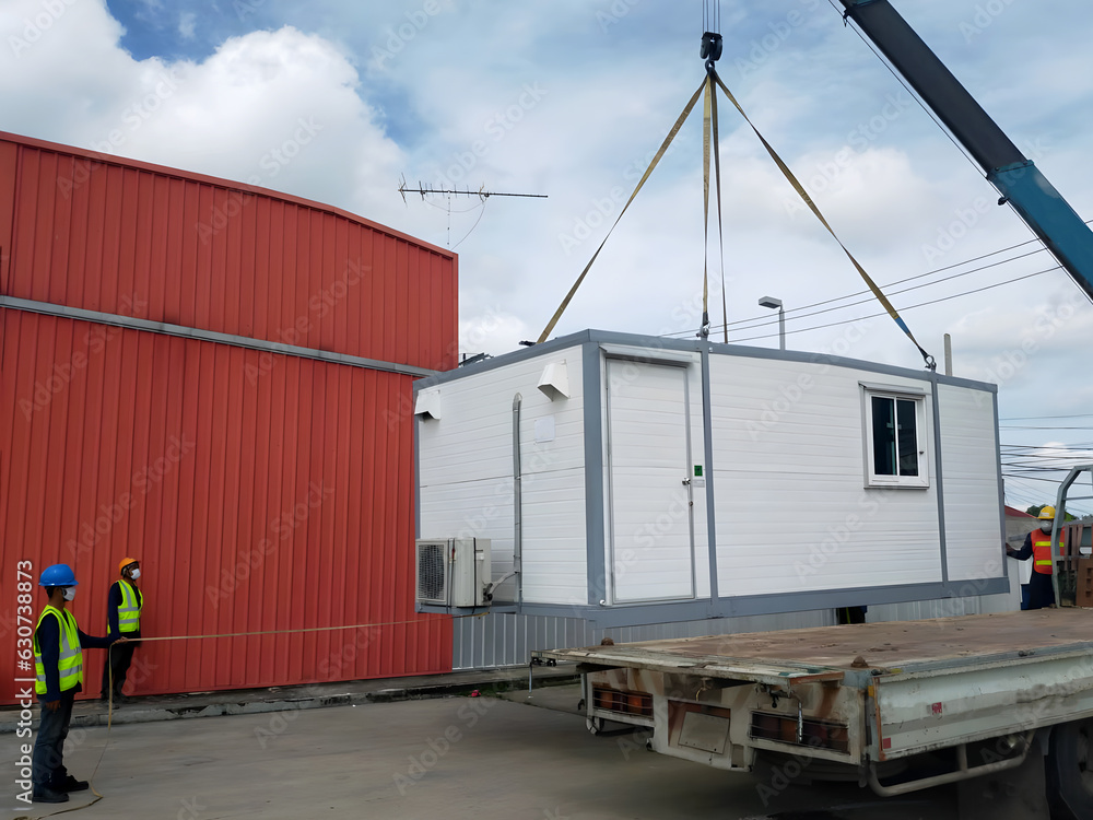 The Crane trucks transport the mobile office buildings or container ...