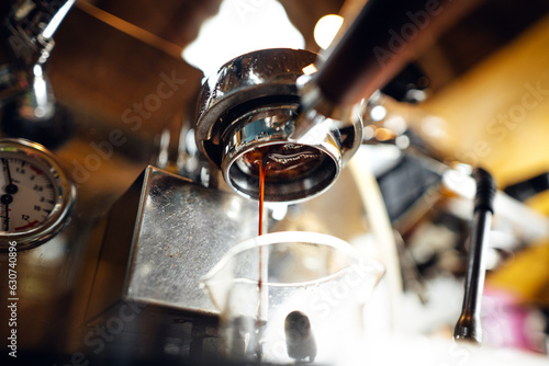 Close-up of coffee pouring in cup