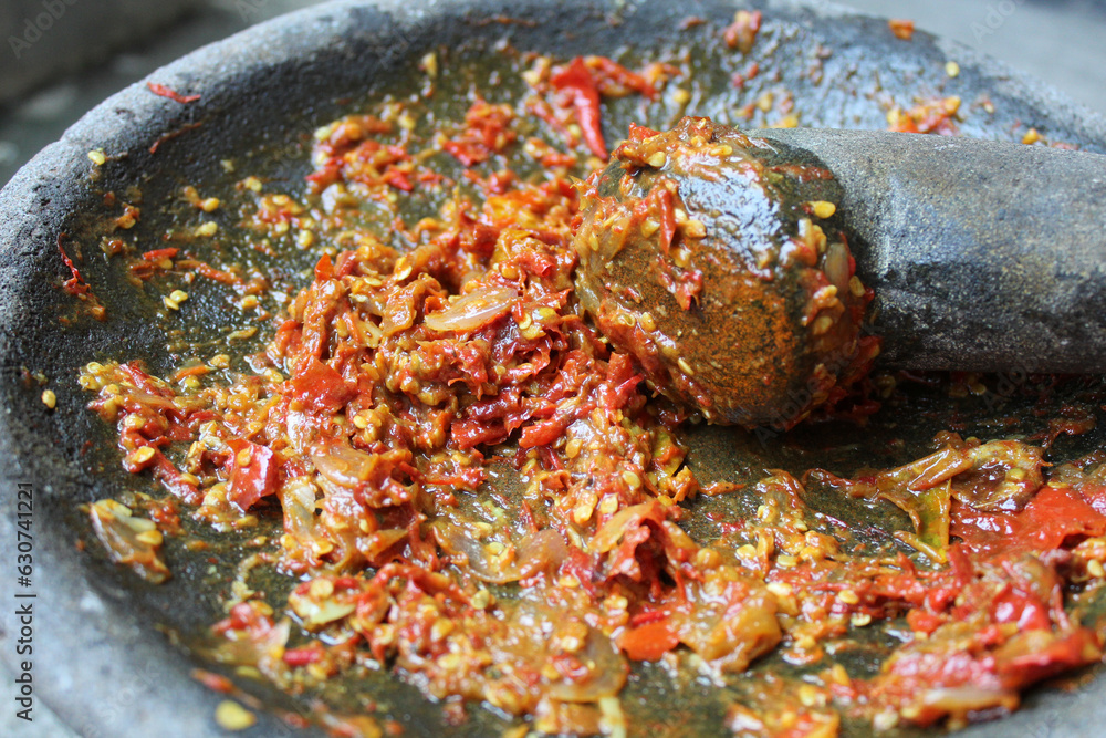 Sambal is an Indonesian chilli sauce or paste, made from red chili pepper and onion, mashed by stone mortar and pestle. Sambal is an Indonesian chilli sauce or paste, made from red chili pepper and onion, mashed by stone mortar and pestle.