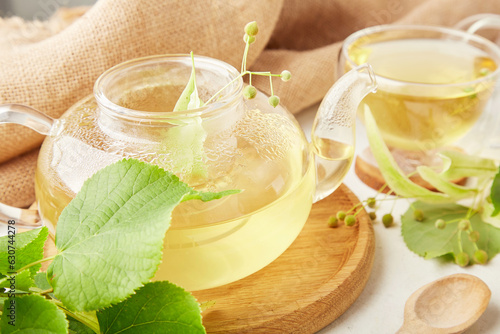 Healthy teapot herbal linden tea. Natural beverage, benefits and properties concept.