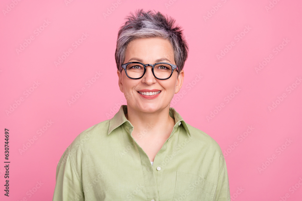 Photo of cheerful successful company lawyer lady beaming smile wear green short isolated on pink color background