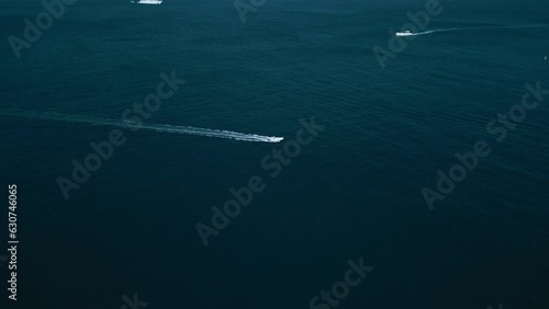 drone video of the coastline in italy, in the frame the blue sea, ships, yachts, rocks, summer holidays
