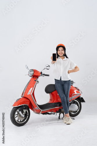 full body photo of a woman wearing a hairdresser and driving a motorbike