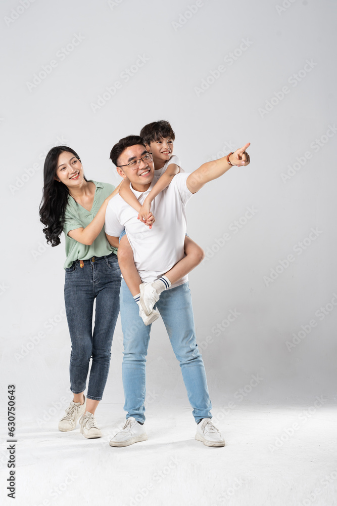 a family posing on a white background a family posing on a white background
