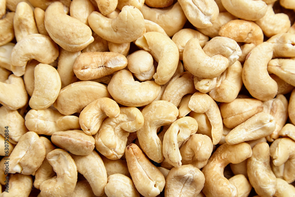 Cashew nut heap food texture background. Many shelled cashew nuts, top view Cashew nut heap food texture background. Many shelled cashew nuts, top view