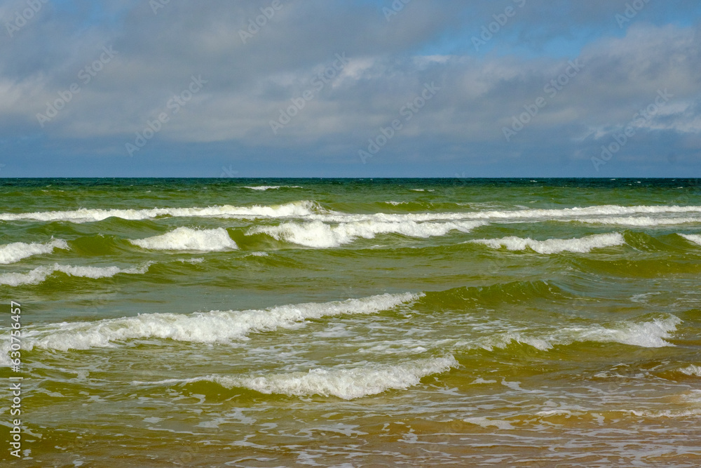 Small waves on the shore of the Baltic Sea in Latvia