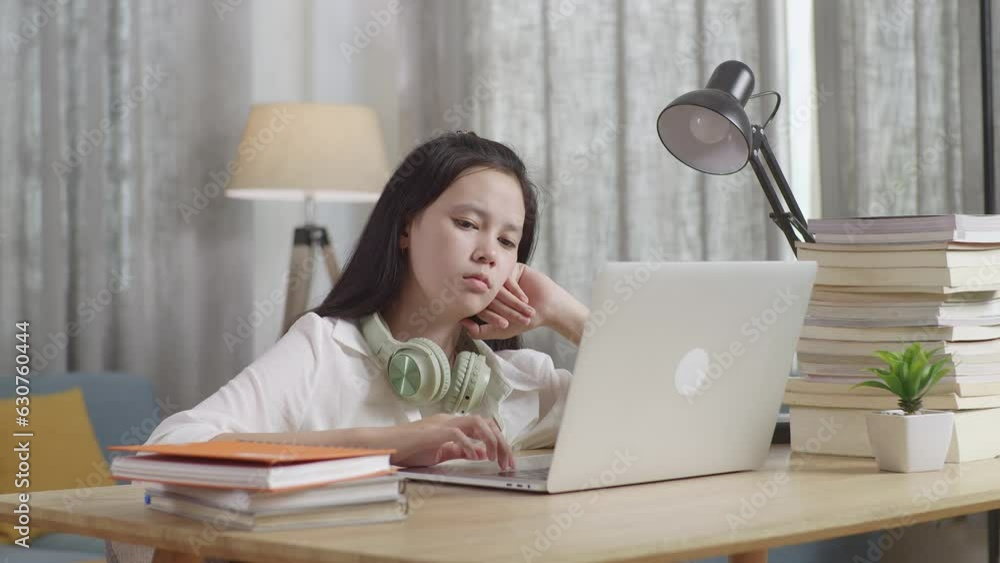 Bored Teenage Girl Learning Online From Laptop At Home
Bored Teenage Girl Learning Online From Laptop At Home